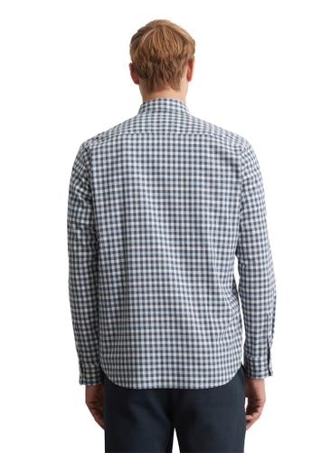 Kent collar, long sleeves, one rectangular chest pocket, round hem